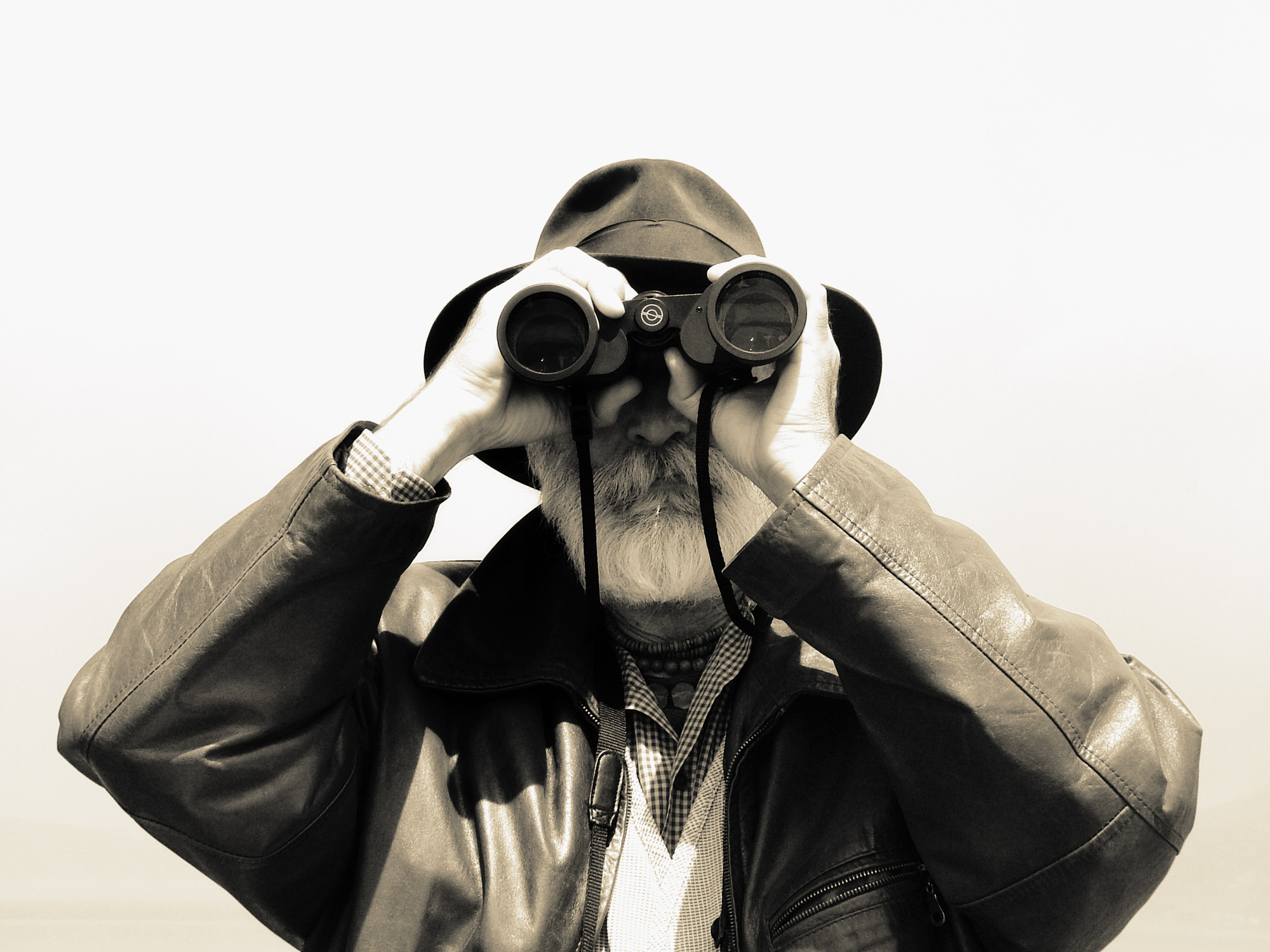 explorer program man with binoculars
